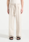 Cream Relaxed Fit Belted Tailored Trousers By Emporeo